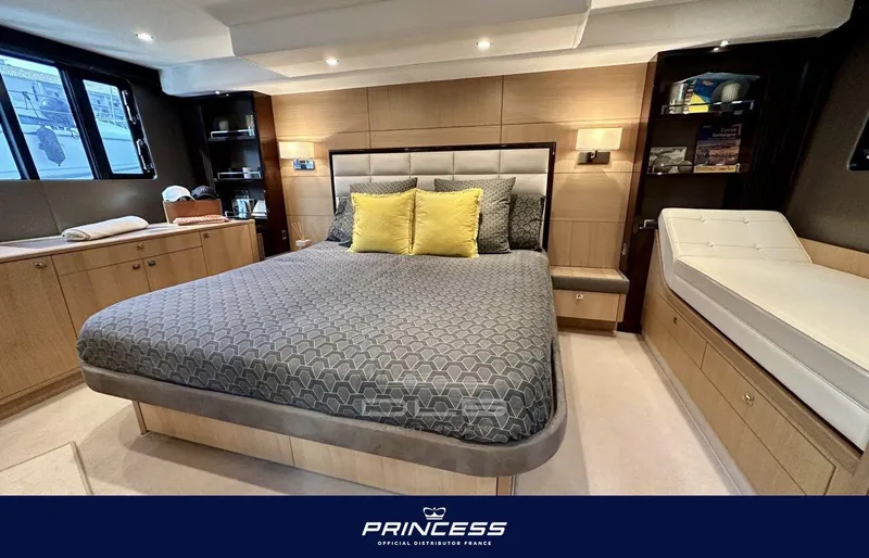  Yacht Photos Pics Luxurious bedroom interior of 2012 Princess 64 yacht with elegant bedding and modern design.