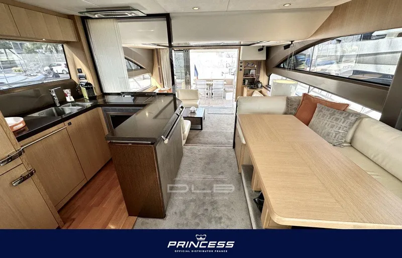  Yacht Photos Pics Luxurious interior of 2012 Princess 64 yacht with modern kitchen and dining area.