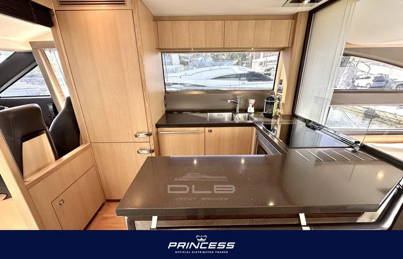  Yacht Photos Pics Luxurious kitchen interior of 2012 Princess 64 yacht with sleek countertops and modern design.