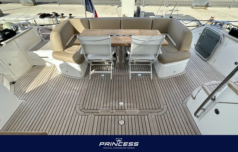  Yacht Photos Pics Luxurious 2012 Princess 64 yacht deck with elegant seating and dining area.