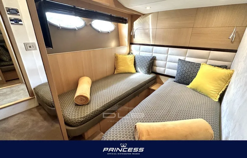  Yacht Photos Pics Luxurious 2012 Princess 64 yacht cabin with twin beds and elegant decor.