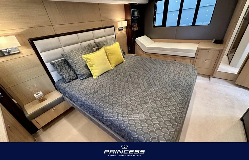  Yacht Photos Pics Luxurious bedroom interior of 2012 Princess 64 yacht with elegant bedding and modern design.