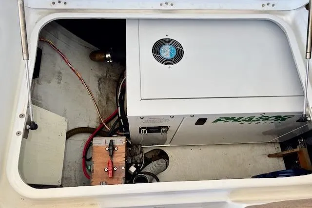 Audacity Yacht Photos Pics Engine compartment of a 2013 Lagoon 450 catamaran, featuring mechanical components and wiring.