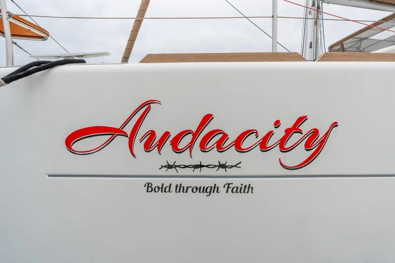 Audacity Yacht Photos Pics Lagoon 450 yacht "Audacity" with "Bold through Faith" inscription, 2013 model.