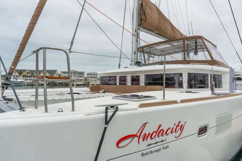 Audacity Yacht Photos Pics 2013 Lagoon 450 catamaran docked, featuring spacious deck and modern design.