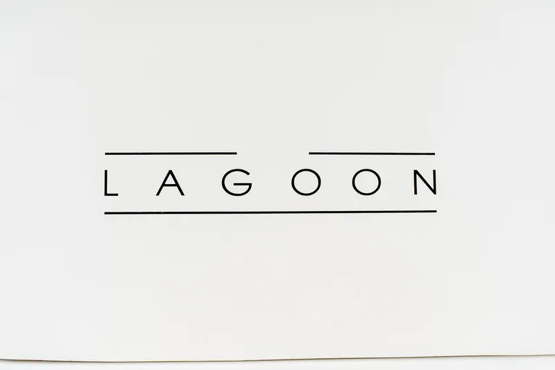 Audacity Yacht Photos Pics Logo of Lagoon 450 catamaran, 2013 model, on a white background.