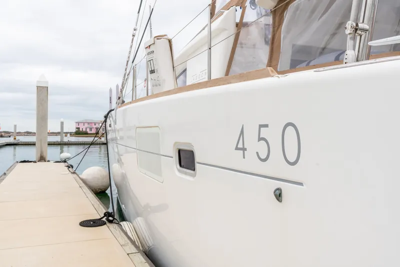 Audacity Yacht Photos Pics Lagoon 450 catamaran from 2013 docked at a marina, side view.