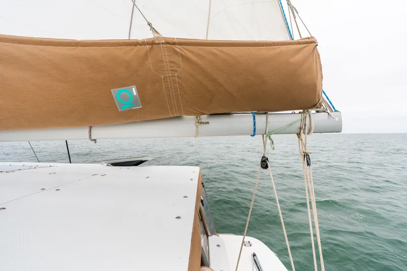 Audacity Yacht Photos Pics Sailing on a 2013 Lagoon 450 catamaran with tan sail cover, ocean view.