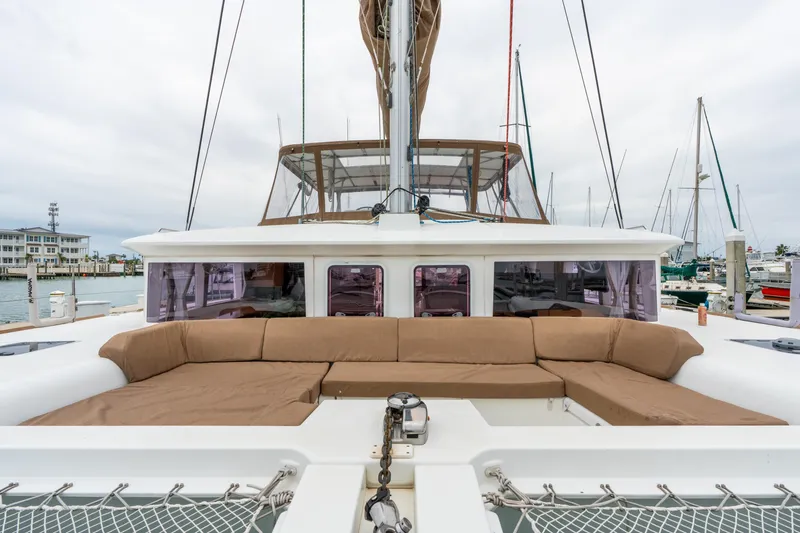 Audacity Yacht Photos Pics 2013 Lagoon 450 catamaran with spacious outdoor seating at a marina.