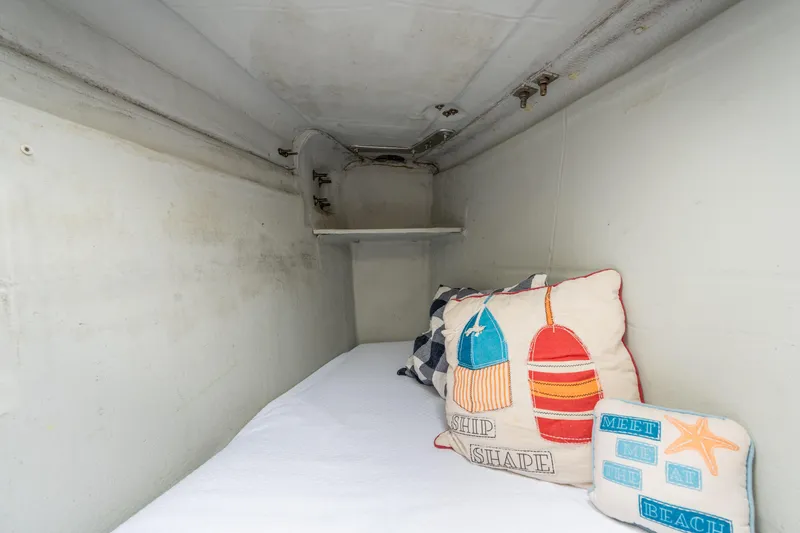 Audacity Yacht Photos Pics Cozy cabin interior of 2013 Lagoon 450 with nautical-themed pillows.