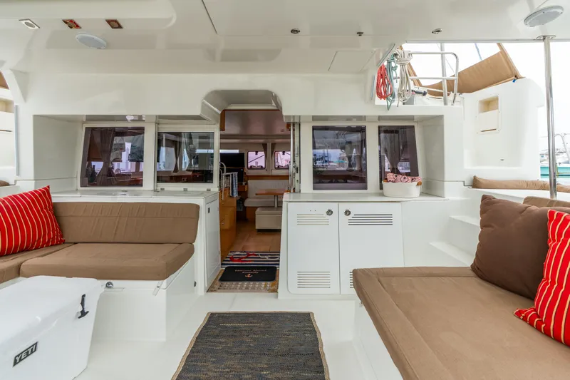 Audacity Yacht Photos Pics Interior of 2013 Lagoon 450 catamaran with cozy seating and nautical decor.
