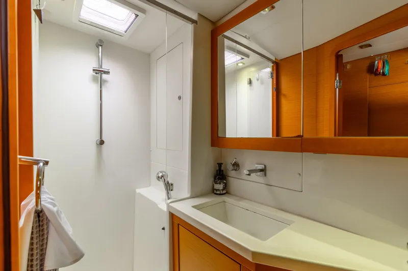 Audacity Yacht Photos Pics Modern bathroom interior on 2013 Lagoon 450 yacht, featuring shower and sink.