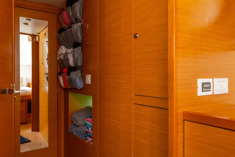 Audacity Yacht Photos Pics Interior of 2013 Lagoon 450 yacht with wooden cabinetry and organized storage.
