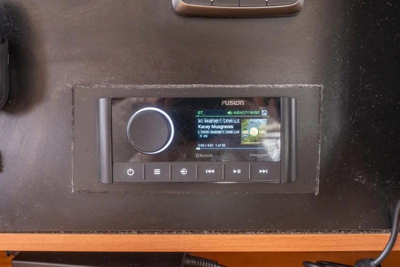 Audacity Yacht Photos Pics Fusion audio system on Lagoon 450 yacht dashboard, displaying music track details.