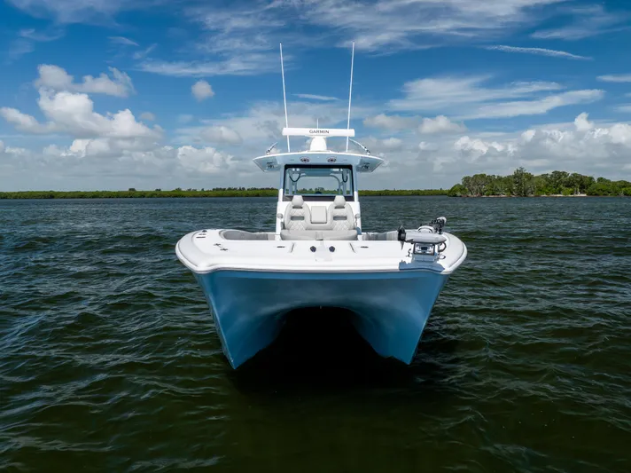  Yacht Photos Pics 2024 Freeman 35 boat on open water under a clear blue sky.