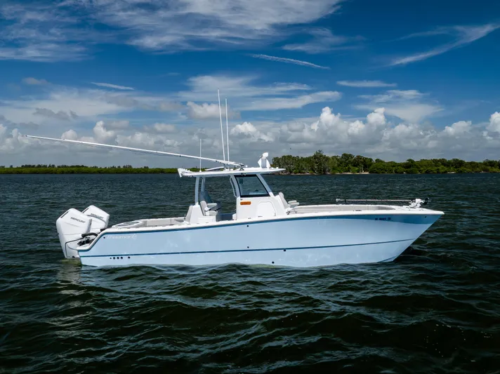  Yacht Photos Pics 2024 Freeman 35 boat on calm water under a clear blue sky.
