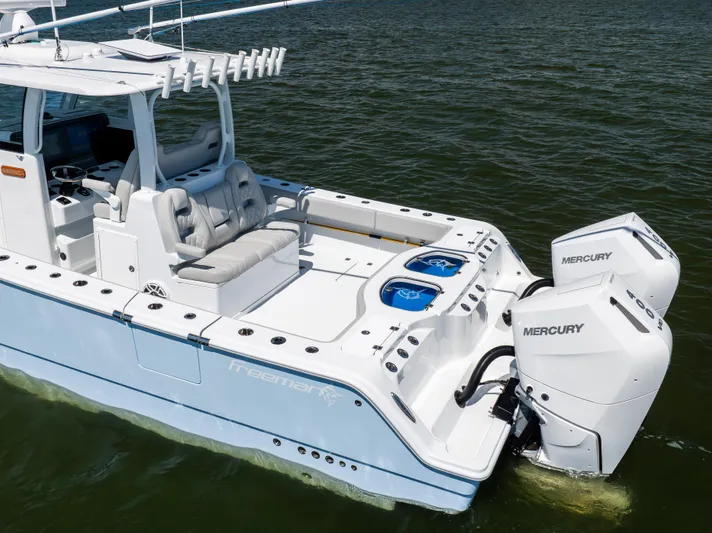  Yacht Photos Pics 2024 Freeman 35 boat with dual Mercury engines on calm water.