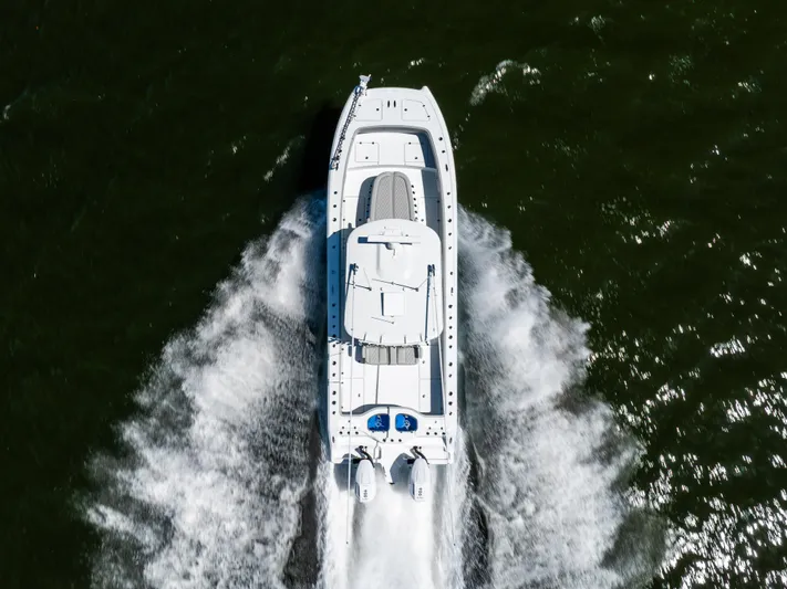  Yacht Photos Pics Aerial view of 2024 Freeman 35 boat speeding on water.