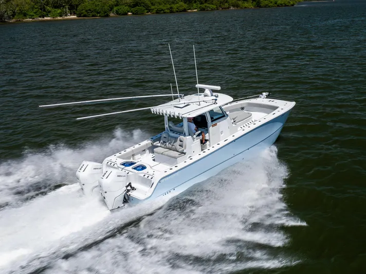  Yacht Photos Pics 2024 Freeman 35 boat cruising on water, showcasing sleek design and powerful engines.