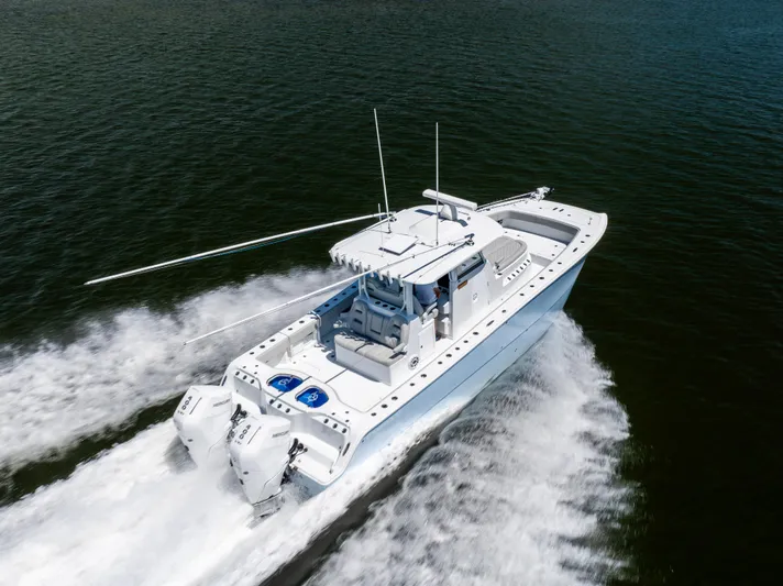  Yacht Photos Pics 2024 Freeman 35 boat cruising swiftly on open water.