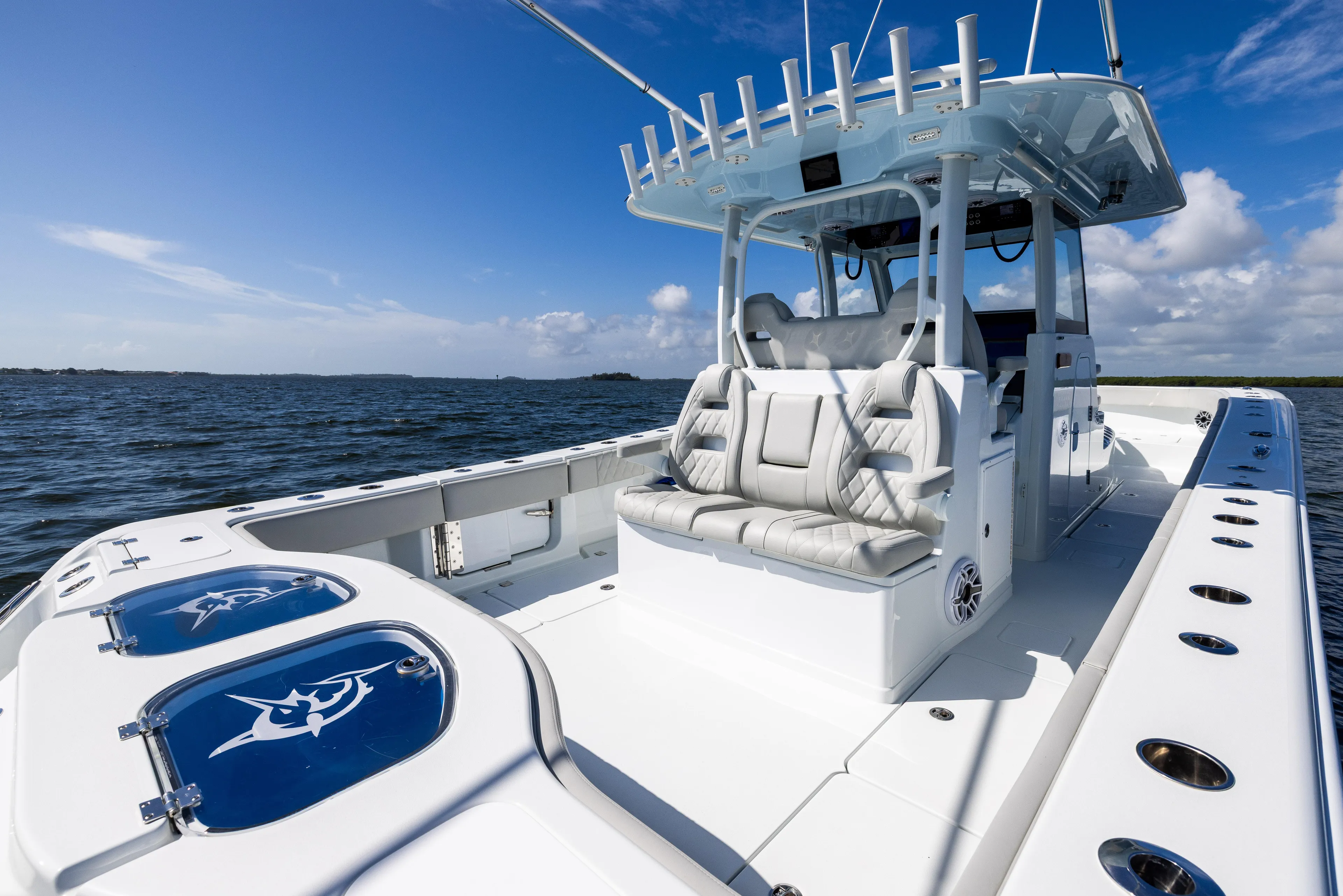  Yacht Photos Pics 2024 Freeman 35 boat with sleek design on open water under blue sky.