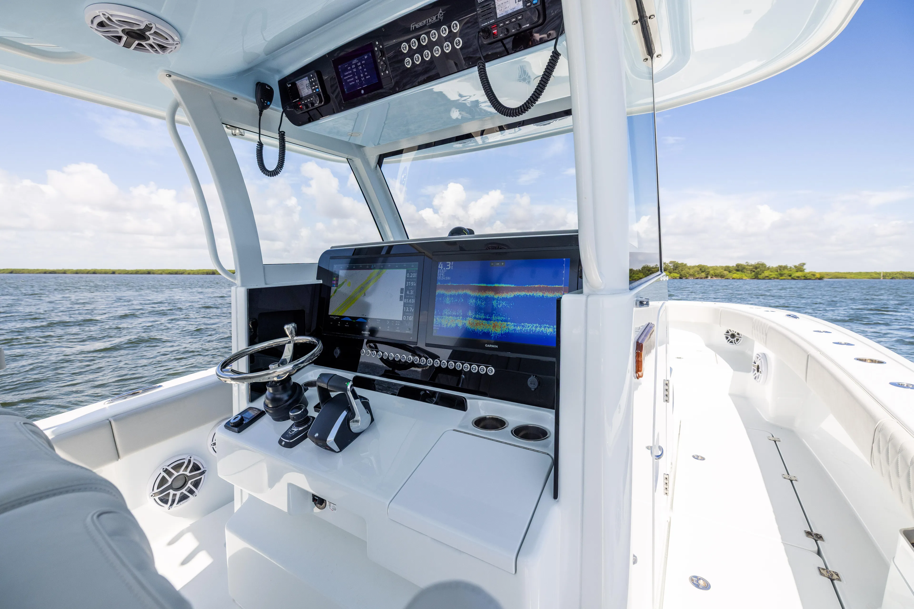  Yacht Photos Pics 2024 Freeman 35 boat cockpit with advanced navigation systems on open water.