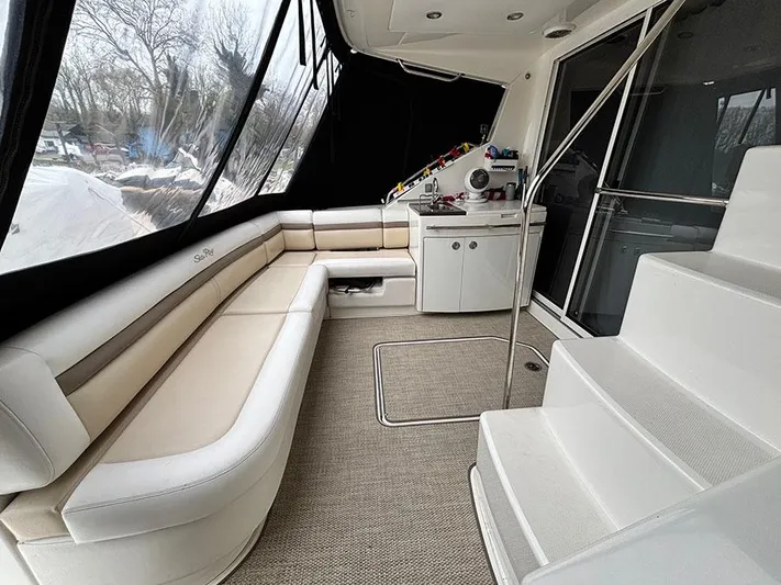  Yacht Photos Pics 2013 Sea Ray 450 Sedan Bridge interior with seating and stairs, featuring modern design.