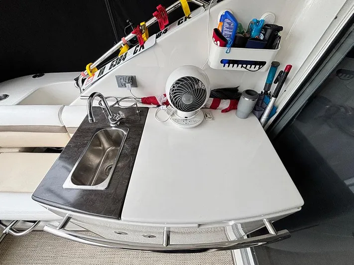  Yacht Photos Pics 2013 Sea Ray 450 Sedan Bridge yacht kitchenette with sink, fan, and storage.