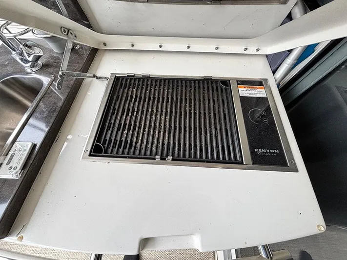  Yacht Photos Pics Built-in Kenyon grill on 2013 Sea Ray 450 Sedan Bridge yacht.