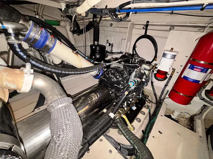  Yacht Photos Pics Engine room of 2013 Sea Ray 450 Sedan Bridge with visible components and fire extinguisher.