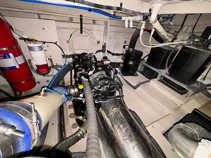  Yacht Photos Pics Engine room of 2013 Sea Ray 450 Sedan Bridge with visible components and fire extinguisher.