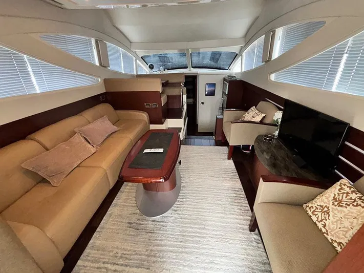  Yacht Photos Pics Luxurious interior of 2013 Sea Ray 450 Sedan Bridge yacht with elegant seating and modern amenities.
