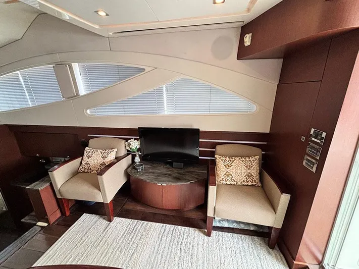  Yacht Photos Pics Luxurious interior of 2013 Sea Ray 450 Sedan Bridge with elegant seating and modern decor.