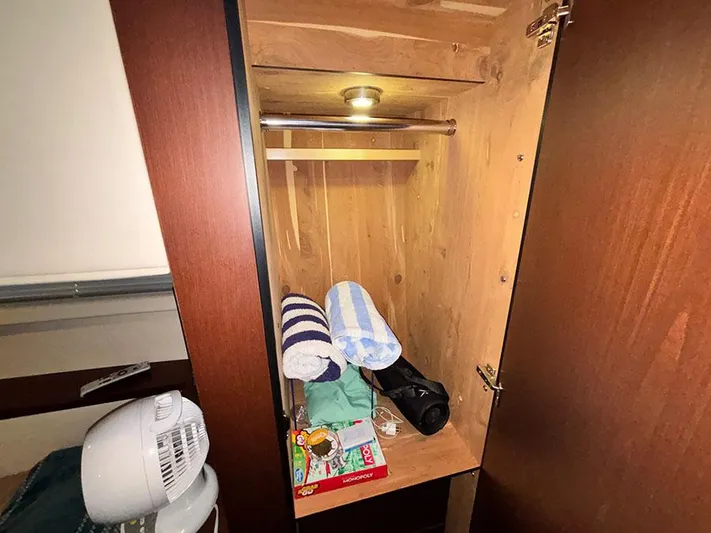  Yacht Photos Pics Cabinet interior on 2013 Sea Ray 450 Sedan Bridge with towels and personal items.