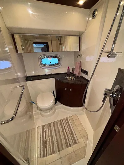  Yacht Photos Pics Luxurious bathroom in 2013 Sea Ray 450 Sedan Bridge yacht with modern fixtures.