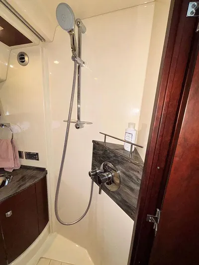  Yacht Photos Pics Shower area in 2013 Sea Ray 450 Sedan Bridge yacht, featuring modern fixtures and sleek design.