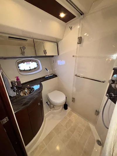  Yacht Photos Pics Luxurious bathroom in 2013 Sea Ray 450 Sedan Bridge yacht with modern fixtures and elegant design.