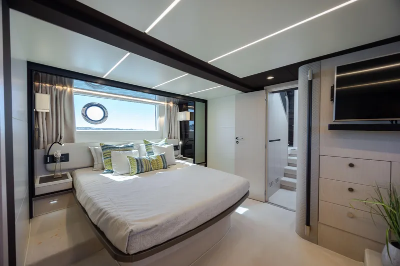  Yacht Photos Pics Luxurious bedroom interior of 2019 Azimut 66 Flybridge yacht with modern design.