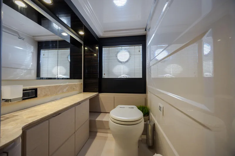  Yacht Photos Pics Luxurious bathroom in 2019 Azimut 66 Flybridge yacht with modern fixtures and elegant design.
