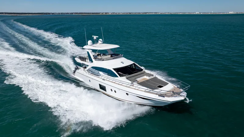  Yacht Photos Pics Azimut 66 Flybridge 2019 yacht cruising on open water, showcasing luxury and speed.