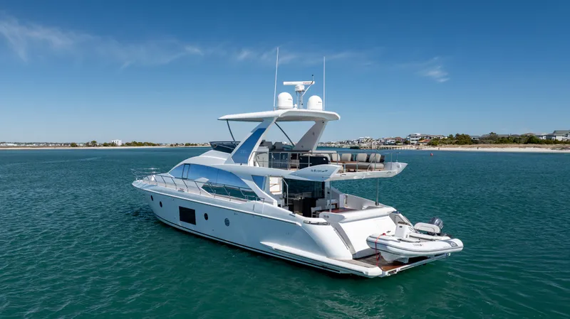 Yacht Photos Pics 2019 Azimut 66 Flybridge yacht on calm blue waters, showcasing luxury design.