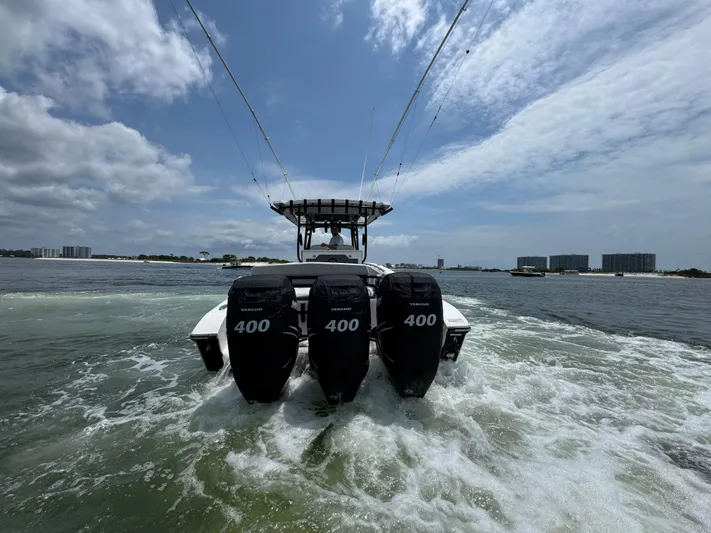  Yacht Photos Pics 2021 Fountain 38TE boat with triple 400 horsepower engines on open water.