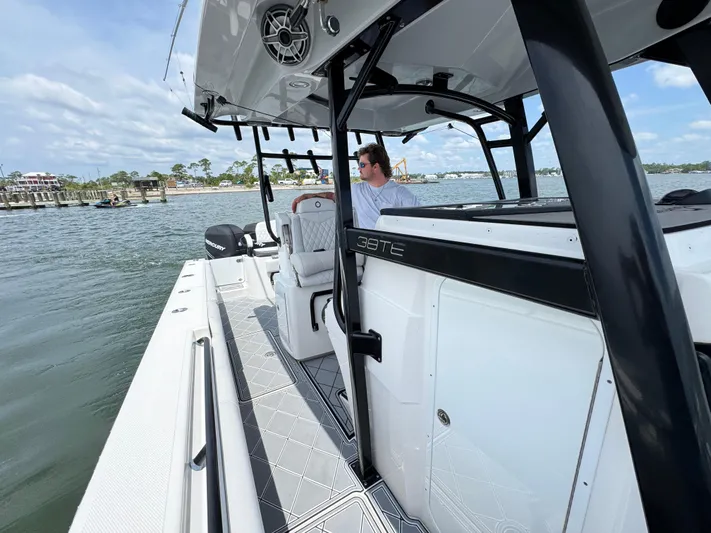  Yacht Photos Pics 2021 Fountain 38TE boat on water, featuring sleek design and modern amenities.