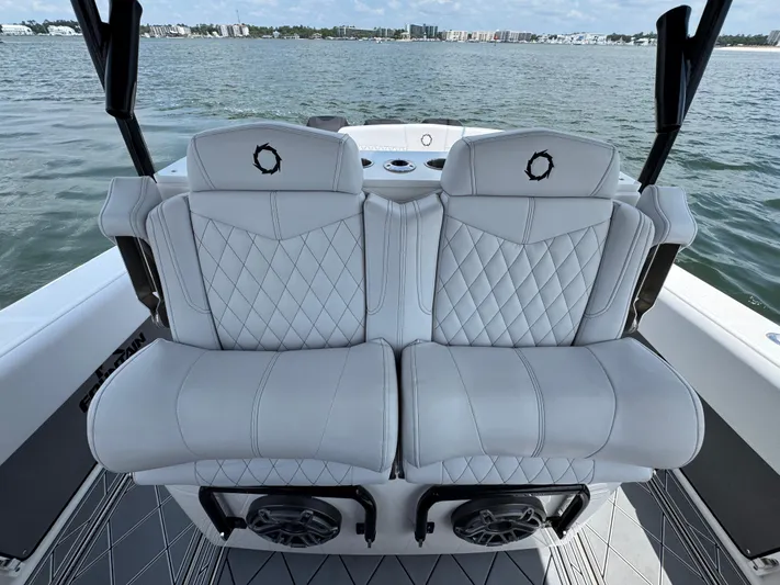  Yacht Photos Pics Luxury seating on a 2021 Fountain 38TE boat with quilted white upholstery.