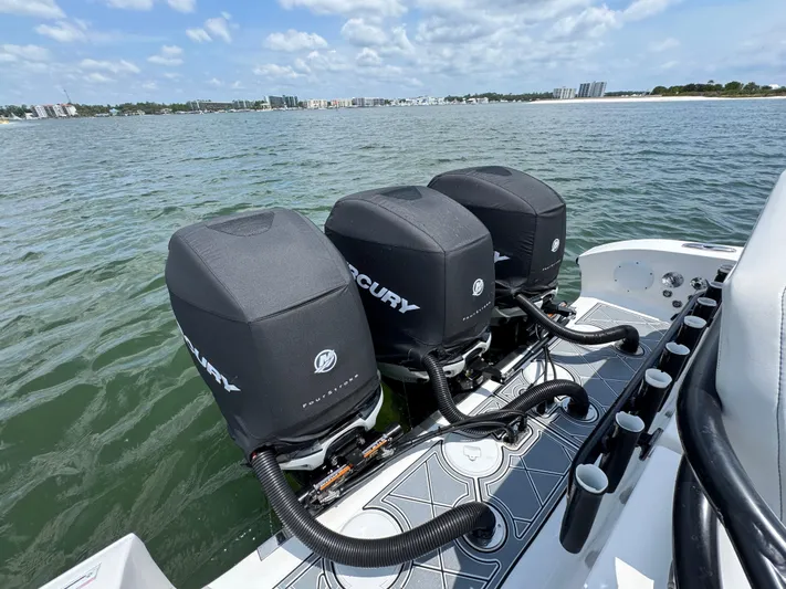  Yacht Photos Pics 2021 Fountain 38TE boat with triple Mercury outboard engines on water.