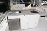 Outdoor kitchen area on a 2018 Leopard 43 Powercat yacht with sink and grill.