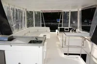 2018 Leopard 43 Powercat interior with helm station and seating area.