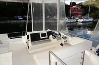 Interior helm station of 2018 Leopard 43 Powercat with navigation equipment and waterfront view.