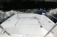 2018 Leopard 43 Powercat bow deck with railing on calm water.