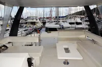 Flybridge view of 2018 Leopard 43 Powercat in marina with surrounding yachts.